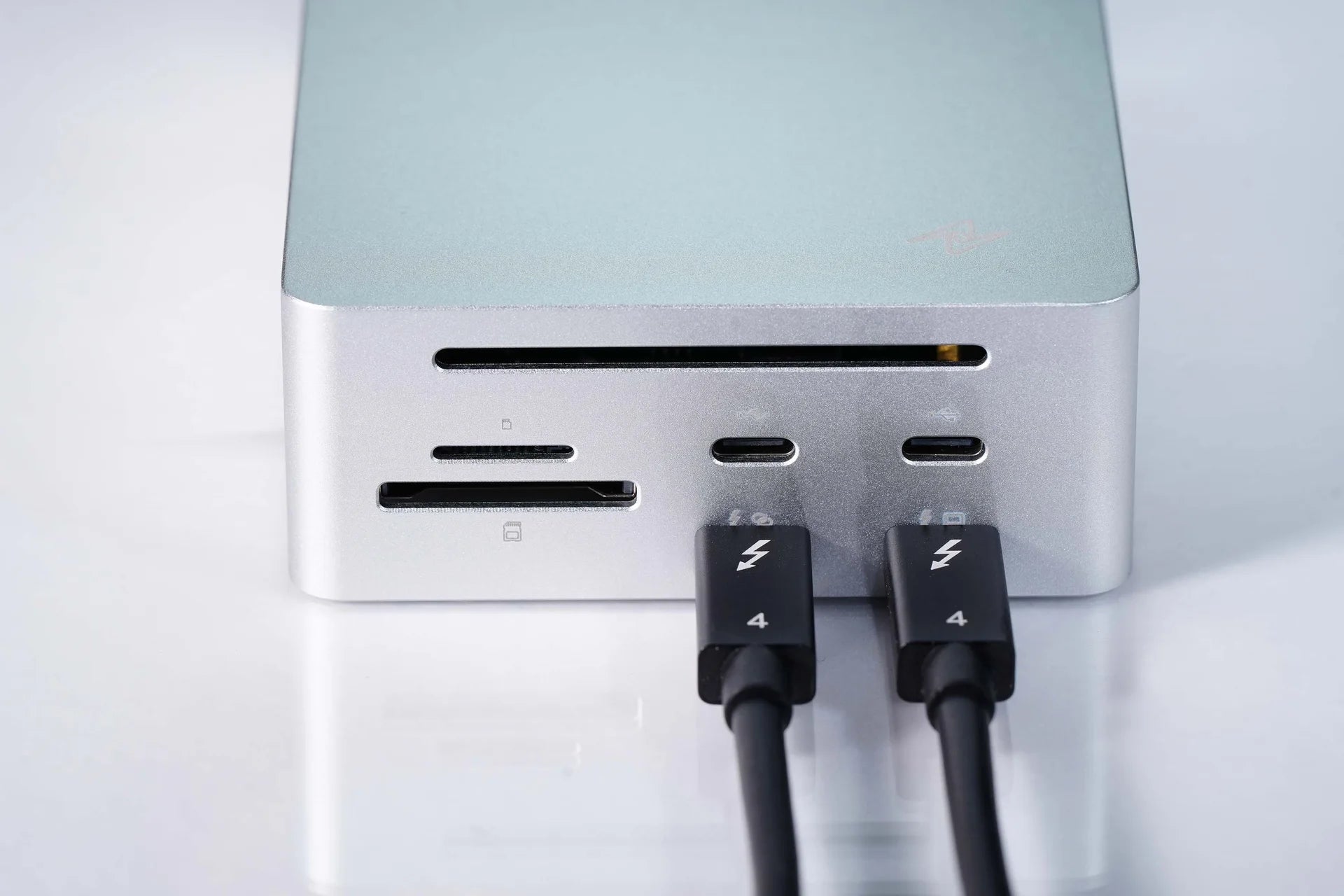 LightOne front I/O with card slots and two Thunderbolt USB-C cables connected
